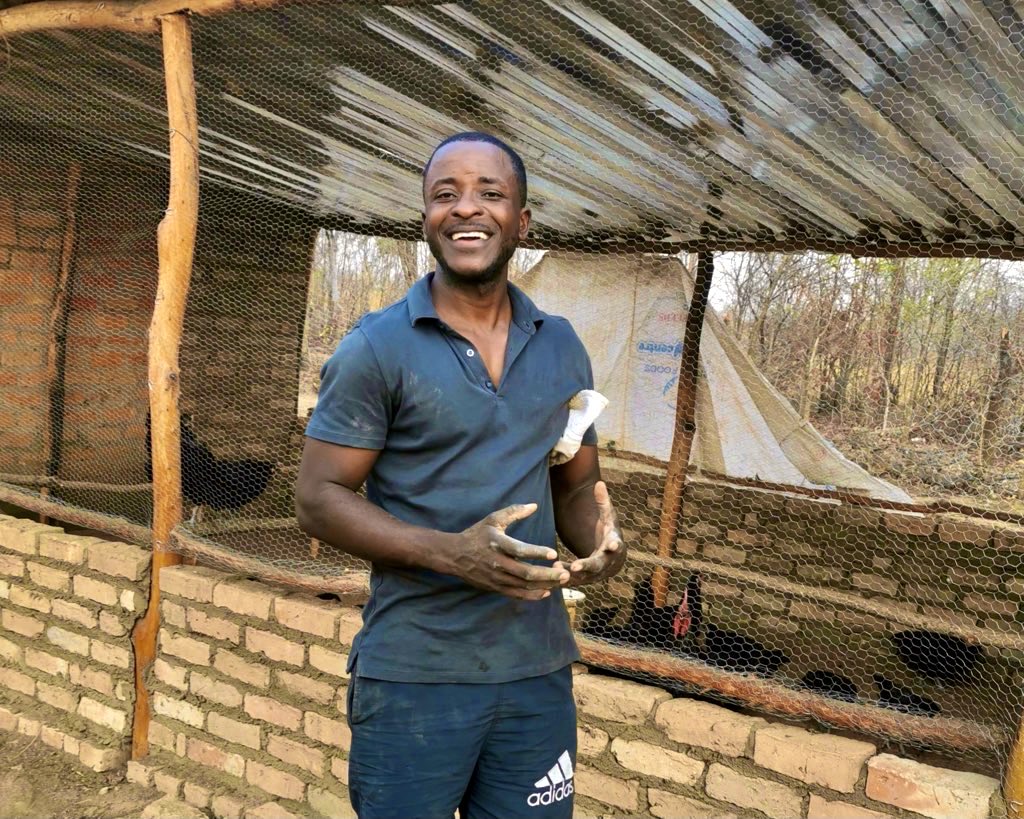 Terrence Maphosa with some of the indigenous chickens.